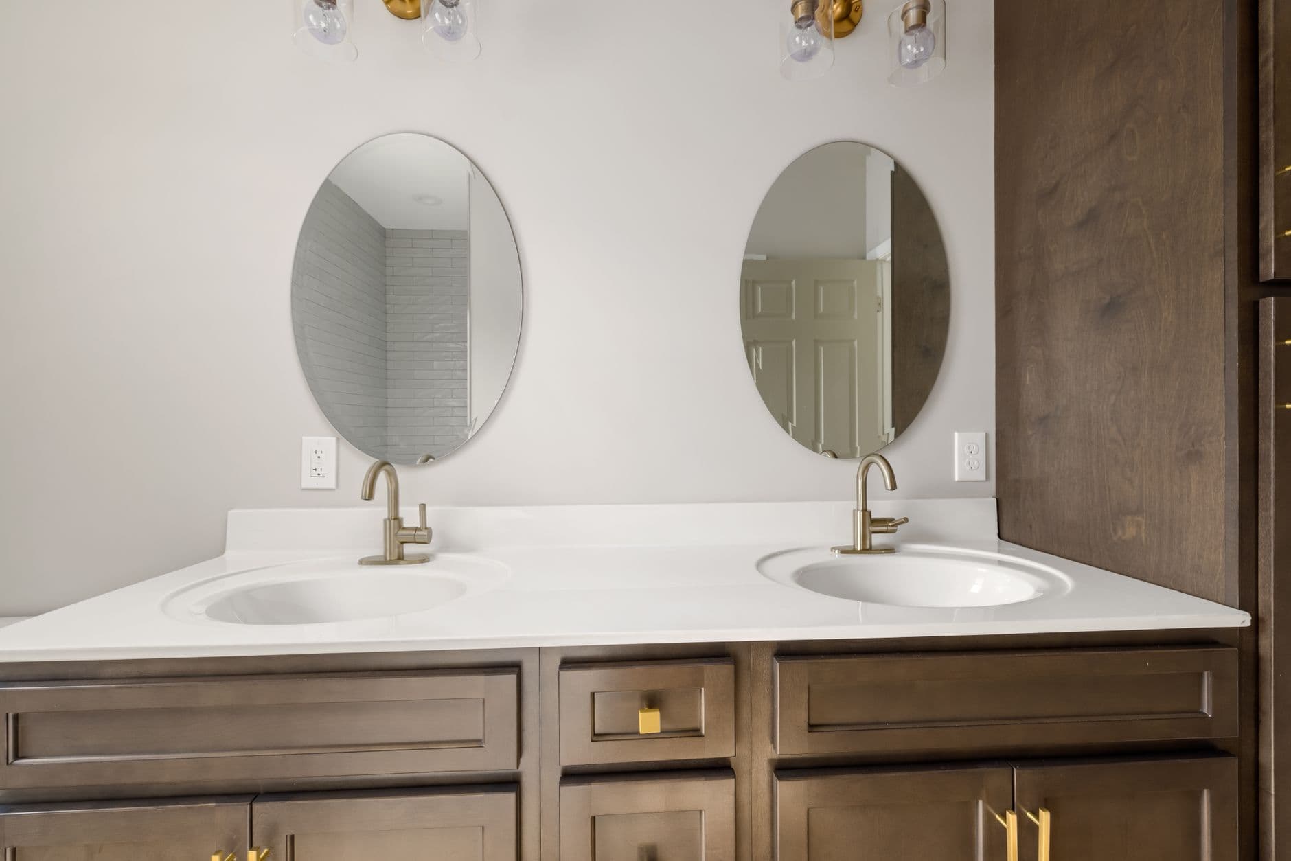 Double bathroom vanity with timber cabinetry and a white benchtop