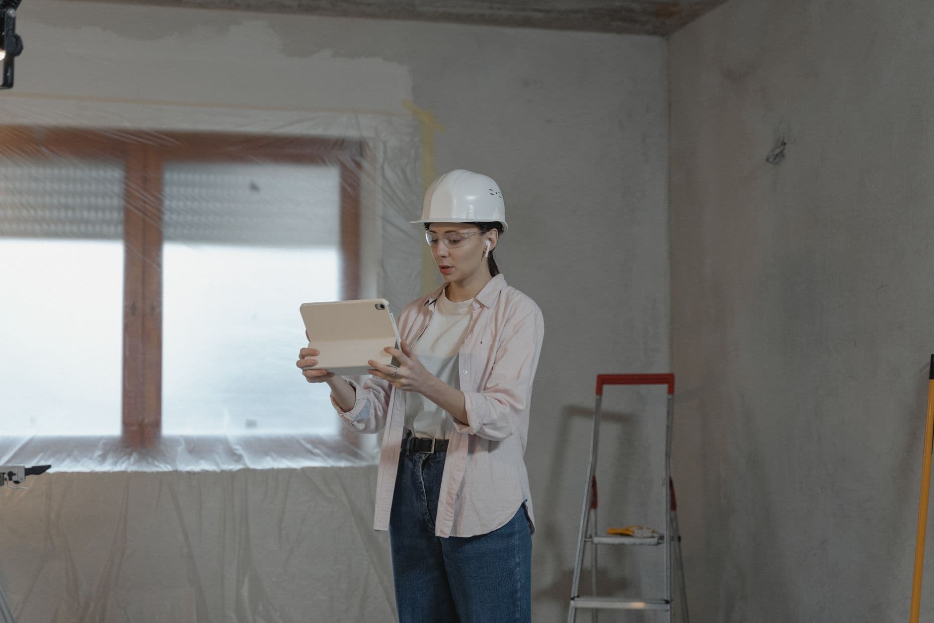 Builder reviewing kitchen renovation plans